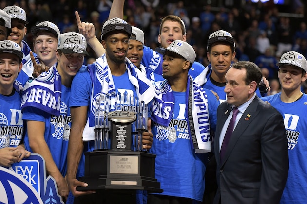 NEW YORK, NY - MARCH 11: Head coach Mike Krzyzewski of the Duke Blue Devils and his team pose for photos with their trophy following their 75-69 victory against the Notre Dame Fighting Irish during the ACC Basketball Tournament Championship game at Barclays Center on March 11, 2017 in the Brooklyn borough of New York City. (Photo by Lance King/Getty Images)