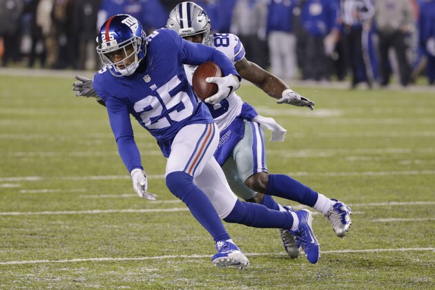 Dallas Cowboys running back Lance Dunbar (25) runs back an interception as Dallas Cowboys' Dez Bryant (88) chases him during the second half of an NFL football game Sunday, Dec. 11, 2016, in East Rutherford, N.J. (AP Photo/Seth Wenig)