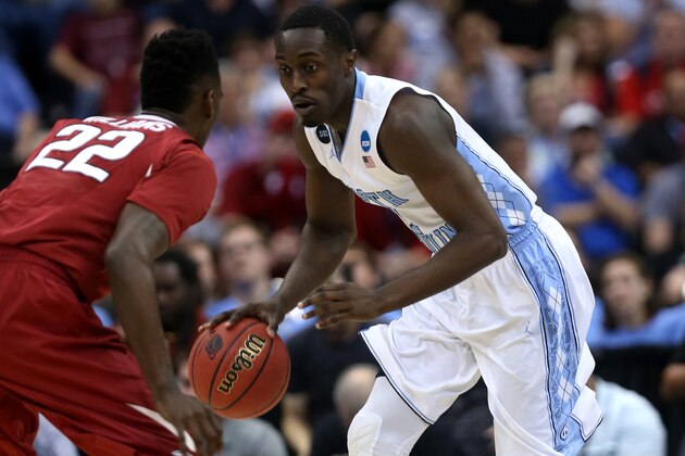 JACKSONVILLE, FL - MARCH 21:  Kennedy Meeks #3 of the North Carolina Tar Heels dribbles in front of Jacorey Williams #22 of the Arkansas Razorbacks in the first half during the third round of the 2015 NCAA Men's Basketball Tournament at Jacksonville Veterans Memorial Arena on March 21, 2015 in Jacksonville, Florida.  (Photo by Mike Ehrmann/Getty Images)