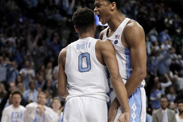 North Carolina forward Isaiah Hicks (4) and guard Nate Britt (0) react in the second half of an NCAA college basketball game against Duke during the semifinals of the Atlantic Coast Conference tournament, Friday, March 10, 2017, in New York. (AP Photo/Julie Jacobson)