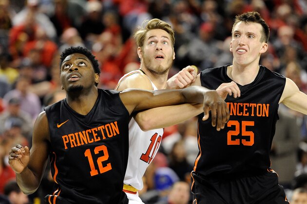 BALTIMORE, MD - DECEMBER 19:  Jake Layman #10 of the Maryland Terrapins boxes out against Myles Stephens #12 and Steven Cook #25 of the Princeton Tigers at Royal Farms Arena on December 19, 2015 in Baltimore, Maryland.  (Photo by G Fiume/Maryland Terrapins/Getty Images)