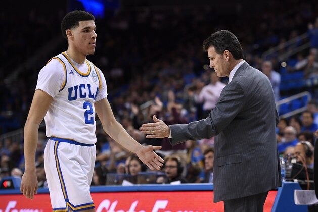 UCLA guard Lonzo Ball, left, is congratulated by head coach Steve Alford as he comes out of the game during the second half of an NCAA college basketball game against Washington, Wednesday, March 1, 2017, in Los Angeles. UCLA won 98-66. (AP Photo/Mark J. Terrill)