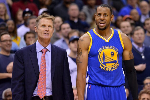 Golden State Warriors head coach Steve Kerr (left) and  Warriors guard Andre Iguodala (9) stand together in the second half of an NBA basketball game Tuesday, Dec. 16, 2014, in Memphis, Tenn. (AP Photo/Brandon Dill)