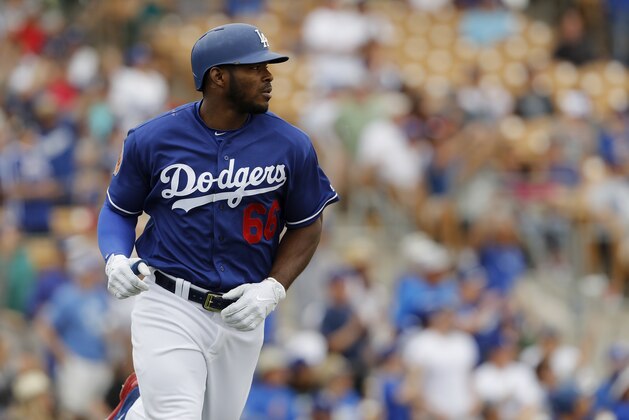 GLENDALE, AZ - MARCH 05: Yasiel Puig #66 of the Los Angeles Dodgers rounds the bases after a home run in the fourth inning against the Seattle Mariners during the spring training game at Camelback Ranch on March 5, 2017 in Glendale, Arizona. (Photo by Tim Warner/Getty Images)