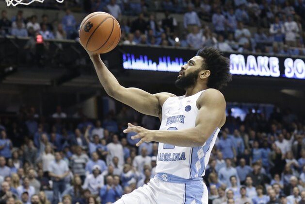 FILE - In this Jan. 14, 2017, file photo, North Carolina's Joel Berry II drives to the basket against Florida State during an NCAA college basketball game in Chapel Hill, N.C. The junior guard is averaging 15.8 points for the ninth-ranked Tar Heels. (AP Photo/Gerry Broome, File)