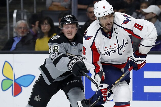 Washington Capitals left wing Alex Ovechkin, right, of Russia, shoots the puck in front of Los Angeles Kings defenseman Paul LaDue during the third period of an NHL hockey game, Saturday, March 11, 2017, in Los Angeles. The Kings won 4-2. (AP Photo/Ryan Kang)