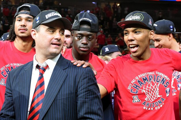 LAS VEGAS, NV - MARCH 11:  (L-R) Keanu Pinder #25, head coach Sean Miller, Rawle Alkins #1 and Allonzo Trier #35 of the Arizona Wildcats celebrate after defeating the Oregon Ducks 83-80 to win the championship game of the Pac-12 Basketball Tournament at T-Mobile Arena on March 11, 2017 in Las Vegas, Nevada.  (Photo by Ethan Miller/Getty Images)