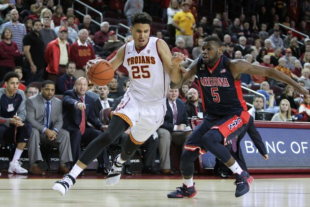 LOS ANGELES, CA - JANUARY 09:  Benny Boatwright #25 of the USC Trojans handles the ball against Kadeem Allen #5 of the Arizona Wildcats in a USC 4OT win 101-103 during a NCAA Pac12 college basketball game at Galen Center on January 9, 2016 in Los Angeles, California.  (Photo by Leon Bennett/Getty Images)