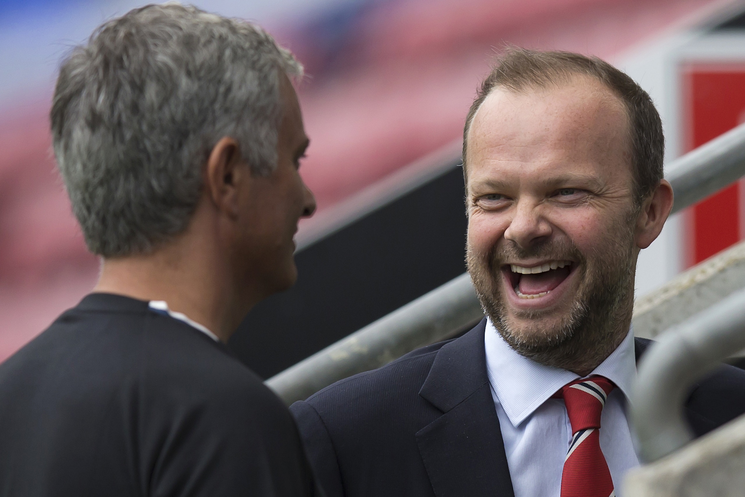 Manchester United's executive vice-chairman Ed Woodward (R) reacts as he talks with Manchester United's Portuguese manager Jose Mourinho folowing the pre-season friendly football match between Wigan Athletic and Manchester United at the DW stadium in Wigan, northwest England, on July 16, 2016. / AFP / JON SUPER / RESTRICTED TO EDITORIAL USE. No use with unauthorized audio, video, data, fixture lists, club/league logos or 'live' services. Online in-match use limited to 75 images, no video emulation. No use in betting, games or single club/league/player publications. / (Photo credit should read JON SUPER/AFP/Getty Images) Manchester United's executive vice-chairman Ed Woodward (R) reacts as he talks with Manchester United's Portuguese manager Jose Mourinho folowing the pre-season friendly football match between Wigan Athletic and Manchester United at the DW stadium in Wigan, northwest England, on July 16, 2016. / AFP / JON SUPER / RESTRICTED TO EDITORIAL USE. No use with unauthorized audio, video, data, fixture lists, club/league logos or 'live' services. Online in-match use limited to 75 images, no video emulation. No use in betting, games or single club/league/player publications. / (Photo credit should read JON SUPER/AFP/Getty Images)