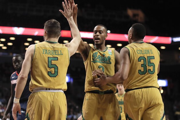 Notre Dame forward V.J. Beachem (3) high-fives guard Matt Farrell (5) and forward Bonzie Colson (35) during the second half of the team's NCAA college basketball game against Virginia during the quarterfinals of the Atlantic Coast Conference tournament, Thursday, March 9, 2017, in New York. Notre Dame won 71-58. (AP Photo/Julie Jacobson)