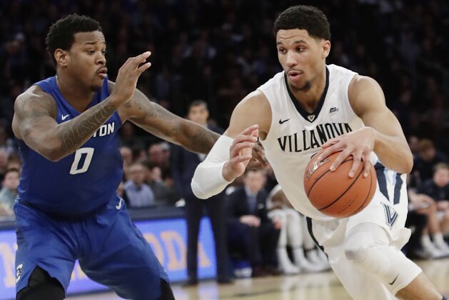 Villanova's Josh Hart (3) drives past Creighton's Marcus Foster (0) during the first half of a championship NCAA college basketball game in the finals of the Big East men's tournament Saturday, March 11, 2017, in New York. (AP Photo/Frank Franklin II)