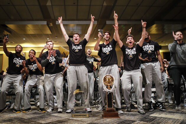 The Northern Kentucky men's basketball team celebrates after their matchup against Kentucky was announced for the NCAA tournament, Sunday, March 12, 2017, in Highland Heights, Ky. NKU secured an automatic berth after winning the Horizon League championship to become the second team since 1970 to be selected for the tournament in its first eligible season. (AP Photo/John Minchillo)