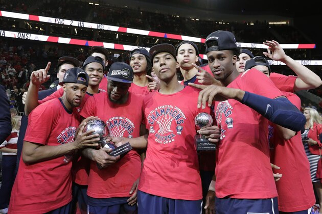 Arizona players, including Allonzo Trier, center right, celebrate after they defeated Oregon Oregon in an NCAA college basketball game in the championship of the Pac-12 men's tournament Saturday, March 11, 2017, in Las Vegas. Arizona won 83-80. (AP Photo/John Locher)