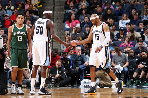 MEMPHIS, TN - MARCH 13: Zach Randolph #50 and Vince Carter #15 of the Memphis Grizzlies high five each other during the game against the Milwaukee Bucks on March 13, 2017 at FedExForum in Memphis, Tennessee. NOTE TO USER: User expressly acknowledges and agrees that, by downloading and or using this photograph, User is consenting to the terms and conditions of the Getty Images License Agreement. Mandatory Copyright Notice: Copyright 2017 NBAE (Photo by Joe Murphy/NBAE via Getty Images)