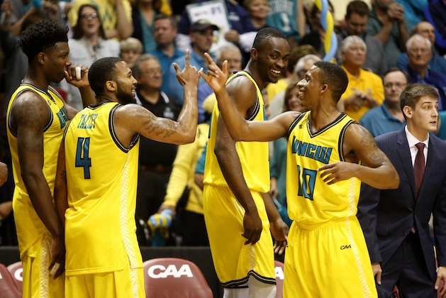 UNC Wilmington celebrate on the bench after defeating College of Charleston 78-69 at the end of an NCAA college championship basketball game in the Colonial Athletic Association tournament at the North Charleston Coliseum in North Charleston, S.C., Monday, March 6, 2017. (AP Photo/Mic Smith)