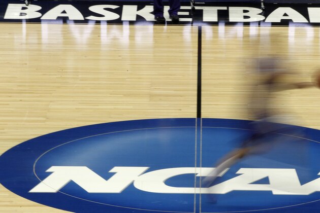 FILE - In this March 14, 2012, file photo made with a long exposure, a player runs across the NCAA logo at midcourt during practice in Pittsburgh before an NCAA tournament college basketball game. Duke and North Carolina State were among the top 16 projected seeds the NCAA revealed Monday, Feb. 6, 2017 for the women's basketball tournament in March, making them potential hosts in a state that's lost several sports events because of a divisive law. (AP Photo/Keith Srakocic) FILE - In this March 14, 2012, file photo made with a long exposure, a player runs across the NCAA logo at midcourt during practice in Pittsburgh before an NCAA tournament college basketball game. Duke and North Carolina State were among the top 16 projected seeds the NCAA revealed Monday, Feb. 6, 2017 for the women's basketball tournament in March, making them potential hosts in a state that's lost several sports events because of a divisive law. (AP Photo/Keith Srakocic)