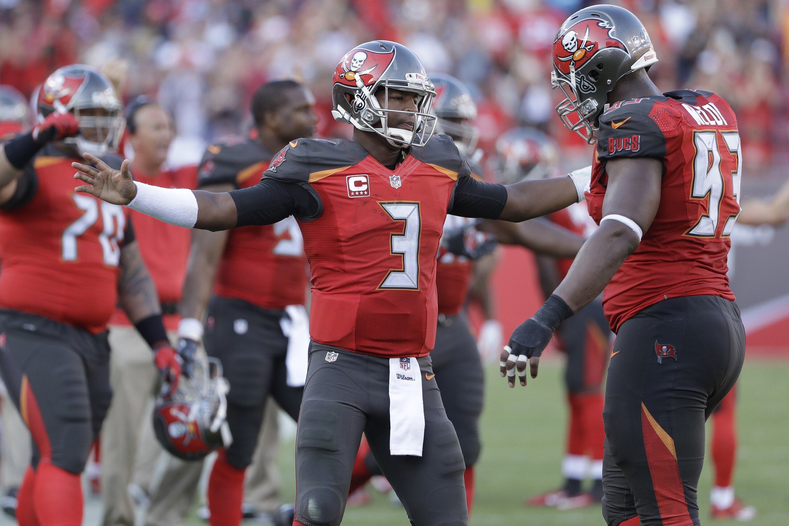 Tampa Bay Buccaneers quarterback Jameis Winston (3) hugs defensive tackle Gerald McCoy (93) after the team broke up a 2-point conversion by the Carolina Panthers during the fourth quarter of an NFL football game Sunday, Jan. 1, 2017, in Tampa, Fla. (AP Photo/Chris O'Meara)