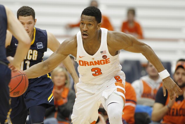 Syracuse's Andrew White III dribbles down court in the second half of an NCAA college basketball NIT game against UNC Greensboro in Syracuse, N.Y., Wednesday, March 15, 2017. Syracuse won 90-77. (AP Photo/Nick Lisi)