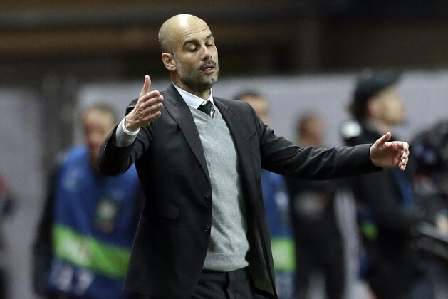 Manchester City's manager Pep Guardiola reacts as his watches his players during a Champions League round of 16 second leg soccer match between Monaco and Manchester City at the Louis II stadium in Monaco, Wednesday March 15, 2017. (AP Photo/Claude Paris)