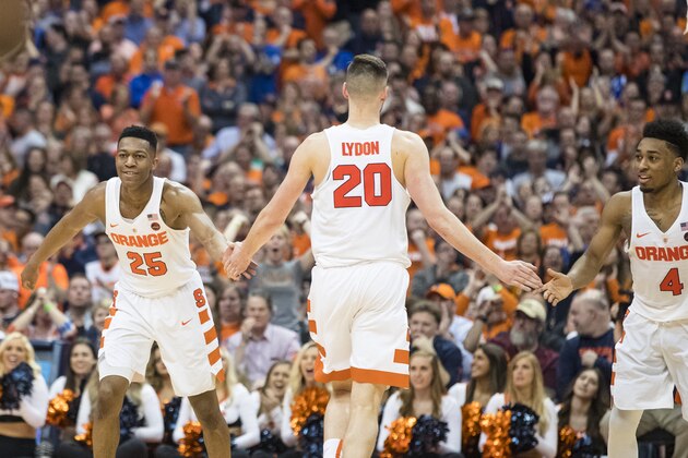 SYRACUSE, NY - FEBRUARY 22:  Tyus Battle #25 and John Gillon #4 congratulate Tyler Lydon #20 of the Syracuse Orange during the second half against the Duke Blue Devils on February 22, 2017 at The Carrier Dome in Syracuse, New York. Syracuse upsets Duke 78-75.  (Photo by Brett Carlsen/Getty Images)