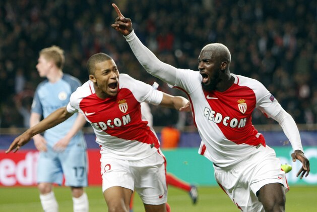 Monaco's Tiemoue Bakayoko, right, celebrates his side side's 3rd goal with Kylian Mbappe during a Champions League round of 16 second leg soccer match between Monaco and Manchester City at the Louis II stadium in Monaco, Wednesday March 15, 2017. (AP Photo/Claude Paris)