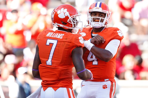 CLEMSON, SC - OCTOBER 4: Deshaun Watson #4 of the Clemson Tigers celebrates with Mike Williams #7 after scoring a touchdown during the game against the North Carolina State Wolfpack at Memorial Stadium on October 4, 2014 in Clemson, South Carolina. (Photo by Tyler Smith/Getty Images)