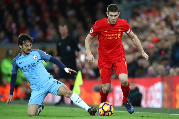 LIVERPOOL, ENGLAND - DECEMBER 31:  David Silva of Manchester City and James Milner of Liverpool clash uring the Premier League match between Liverpool and Manchester City at Anfield on December 31, 2016 in Liverpool, England.  (Photo by Clive Brunskill/Getty Images)