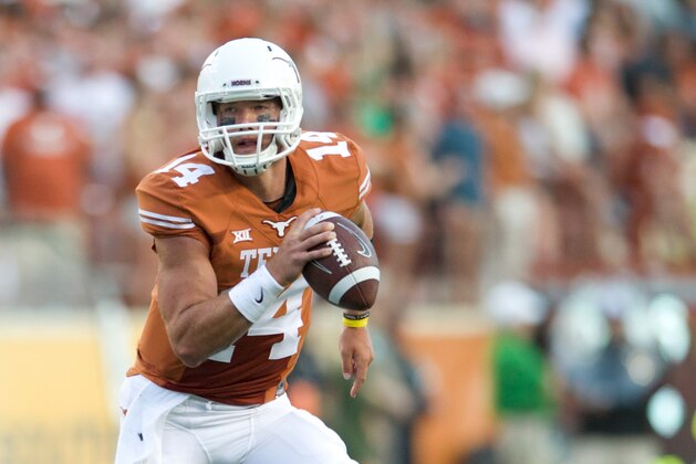 AUSTIN, TX - AUGUST 30:  David Ash #14 of the Texas Longhorns scrambles against the North Texas Mean Green on August 30, 2014 at Darrell K Royal-Texas Memorial Stadium in Austin, Texas.  (Photo by Cooper Neill/Getty Images)