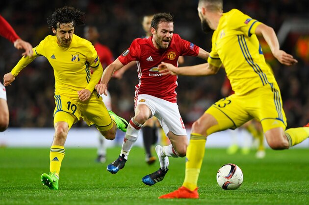 MANCHESTER, ENGLAND - MARCH 16:  Juan Mata of Manchester United is fouled by Khoren Bayramyan of FC Rostov during the UEFA Europa League Round of 16, second leg match between Manchester United and FK Rostov at Old Trafford on March 16, 2017 in Manchester, United Kingdom.  (Photo by Stu Forster/Getty Images)