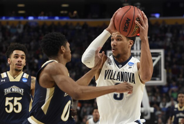 Mar 16, 2017; Buffalo, NY, USA; Villanova Wildcats guard Josh Hart (3) drives to the basket against Mount St. Mary's Mountaineers guard Junior Robinson (0) in the second half during the first round of the NCAA Tournament at KeyBank Center. Mandatory Credit: Mark Konezny-USA TODAY Sports