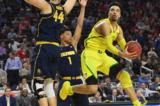 LAS VEGAS, NV - MARCH 10:  Dillon Brooks #24 of the Oregon Ducks shoots against Kameron Rooks #44 and Ivan Rabb #1 of the California Golden Bears during a semifinal game of the Pac-12 Basketball Tournament at T-Mobile Arena on March 10, 2017 in Las Vegas, Nevada. Oregon won 73-65.  (Photo by Ethan Miller/Getty Images)