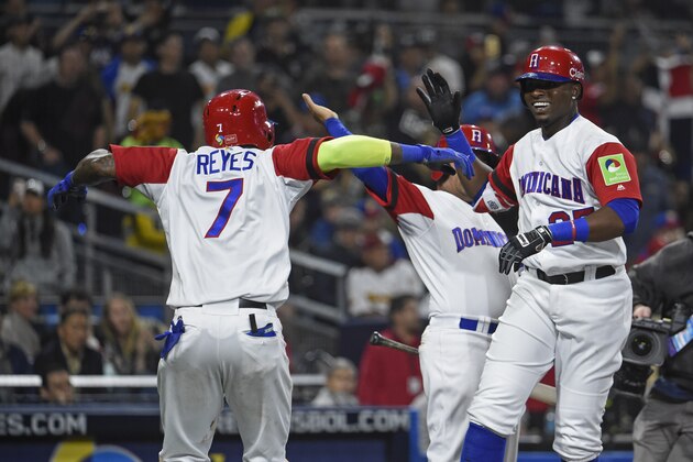 SAN DIEGO, CA - MARCH 16: Gregory Polanco #25 of the Dominican Republic, right, is congratulated by Jose Reyes #7 after hitting a solo home run during the fifth inning of the World Baseball Classic Pool F Game Three between Venezuela and the Dominican Republic at PETCO Park on March 16, 2017 in San Diego, California.  (Photo by Denis Poroy/Getty Images)