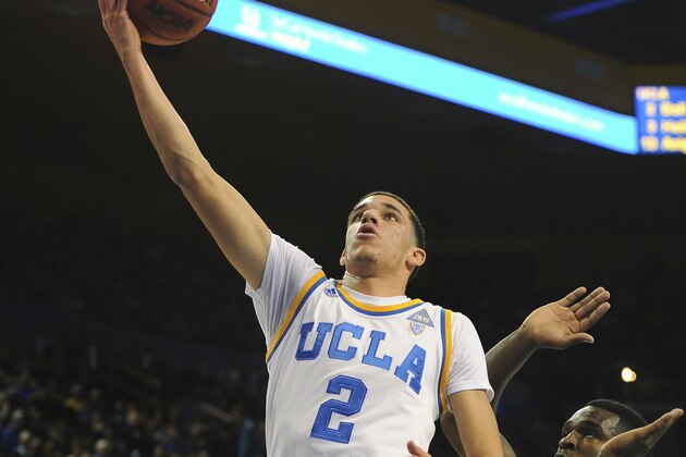 FILE - In this Jan. 5, 2017, file photo, UCLA guard Lonzo Ball goes for a fast break past California's Jabari Bird during an NCAA college basketball game in Los Angeles. The freshman ranks as one of the nation's assist leaders for the third-ranked Bruins. (AP Photo/Michael Owen Baker, File) FILE - In this Jan. 5, 2017, file photo, UCLA guard Lonzo Ball goes for a fast break past California's Jabari Bird during an NCAA college basketball game in Los Angeles. The freshman ranks as one of the nation's assist leaders for the third-ranked Bruins. (AP Photo/Michael Owen Baker, File)