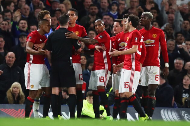 LONDON, ENGLAND - MARCH 13:  Manchester United players protest as Ander Herrera of Manchester United (4R) is shown a red card by referee Michael Oliver and is sent off during The Emirates FA Cup Quarter-Final match between Chelsea and Manchester United at Stamford Bridge on March 13, 2017 in London, England.  (Photo by Julian Finney/Getty Images)