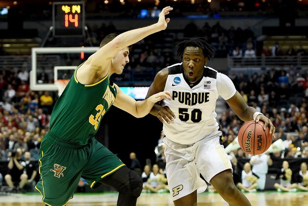MILWAUKEE, WI - MARCH 16:  Caleb Swanigan #50 of the Purdue Boilermakers dribbles the ball while being guarded by Payton Henson #35 of the Vermont Catamounts in the first half during the first round of the 2017 NCAA Men's Basketball Tournament at BMO Harris Bradley Center on March 16, 2017 in Milwaukee, Wisconsin. (Photo by Stacy Revere/Getty Images)