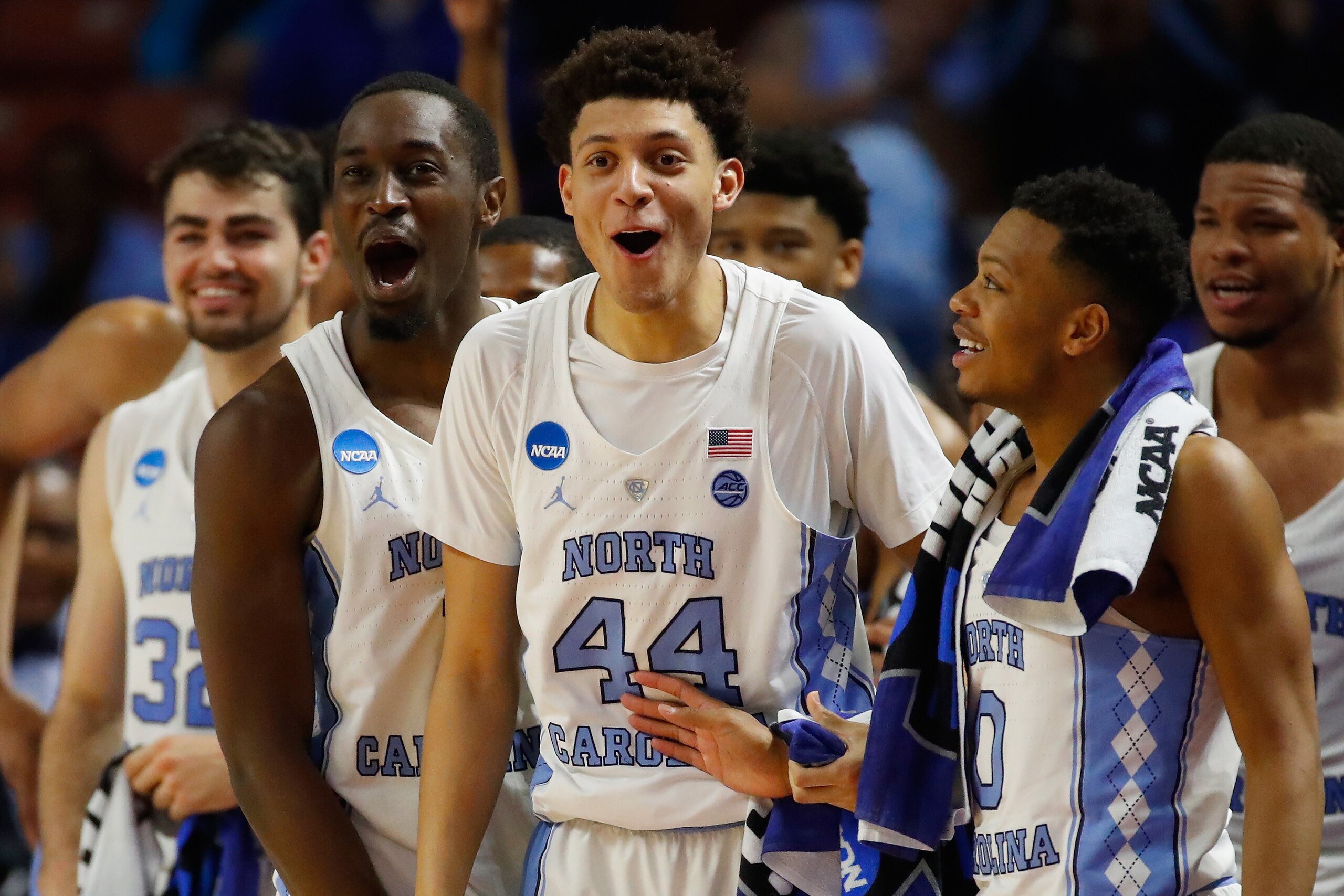 GREENVILLE, SC - MARCH 17:  Luke Maye #32, Theo Pinson #1, Justin Jackson #44, Nate Britt #0 of the North Carolina Tar Heels and teammate celebrate from the bench in the second half against the Texas Southern Tigers during the first round of the 2017 NCAA Men's Basketball Tournament at Bon Secours Wellness Arena on March 17, 2017 in Greenville, South Carolina. North Carolina Tar Heels won 103-64.  (Photo by Gregory Shamus/Getty Images)