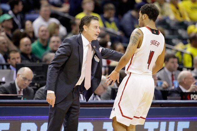 INDIANAPOLIS, IN - MARCH 17:  Head coach Rick Pitino of the Louisville Cardinals talks with Quentin Snider #4 of the Louisville Cardinals against the Jacksonville State Gamecocks during the first round of the 2017 NCAA Men's Basketball Tournament at Bankers Life Fieldhouse on March 17, 2017 in Indianapolis, Indiana.  (Photo by Andy Lyons/Getty Images)