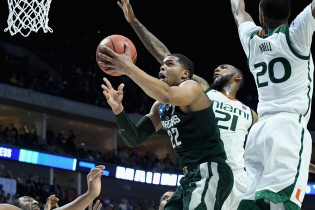 TULSA, OK - MARCH 17:  Miles Bridges #22 of the Michigan State Spartans drives to the basket against Kamari Murphy #21 of the Miami (Fl) Hurricanes during the first round of the 2017 NCAA Men's Basketball Tournament at BOK Center on March 17, 2017 in Tulsa, Oklahoma.  (Photo by J Pat Carter/Getty Images)