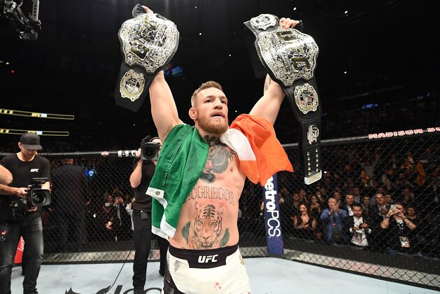 NEW YORK, NY - NOVEMBER 12:  UFC lightweight and featherweight champion Conor McGregor of Ireland celebrates after defeating Eddie Alvarez in their UFC lightweight championship fight during the UFC 205 event at Madison Square Garden on November 12, 2016 in New York City. (Photo by Jeff Bottari/Zuffa LLC/Zuffa LLC via Getty Images)