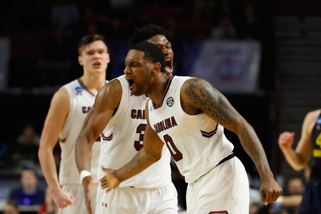 GREENVILLE, SC - MARCH 17:  Sindarius Thornwell #0 and Chris Silva #30 of the South Carolina Gamecocks celebrate in the second half against the Marquette Golden Eagles during the first round of the 2017 NCAA Men's Basketball Tournament at Bon Secours Wellness Arena on March 17, 2017 in Greenville, South Carolina.  (Photo by Gregory Shamus/Getty Images)