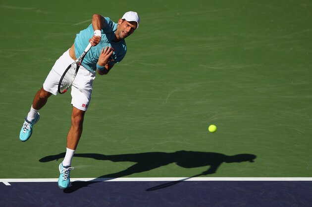 INDIAN WELLS, CA - MARCH 15: Novak Djokovic of Serbia serves during his straight set defeat by Nick Kyrgios of Australia in their fourth round match during day ten of the BNP Paribas Open at Indian Wells Tennis Garden on March 15, 2017 in Indian Wells, California. (Photo by Clive Brunskill/Getty Images) INDIAN WELLS, CA - MARCH 15: Novak Djokovic of Serbia serves during his straight set defeat by Nick Kyrgios of Australia in their fourth round match during day ten of the BNP Paribas Open at Indian Wells Tennis Garden on March 15, 2017 in Indian Wells, California. (Photo by Clive Brunskill/Getty Images)