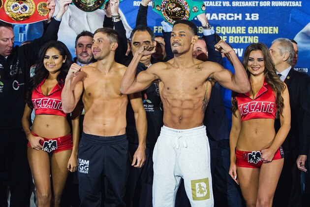 Middleweight champion Gennady Golovkin, center left, poses with challenger Daniel Jacobs, center right, after the official weigh-in at Madison Square Garden in New York, Friday, March 17, 2017. Golovkin will put his belts on the line against Jacobs on Saturday, March 18 at Madison Square Garden. (AP Photo/Andres Kudacki)