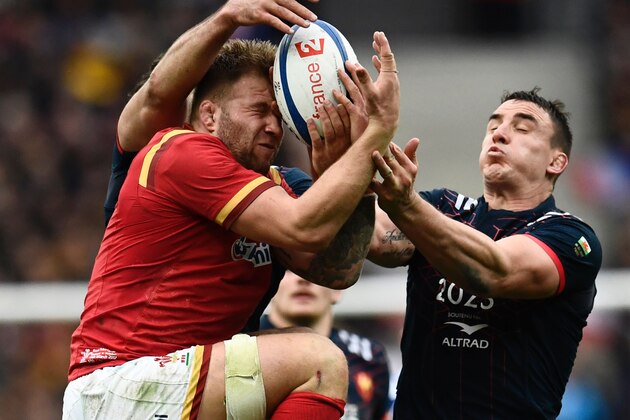 Wales' prop Tomas Francis (L) jumps to grab the ball despite France's flanker Louis Picamoles  during the Six Nations tournament Rugby Union match between France and Wales at the Stade de France in Saint-Denis, outside Paris, on March 18, 2017.  / AFP PHOTO / CHRISTOPHE SIMON        (Photo credit should read CHRISTOPHE SIMON/AFP/Getty Images)