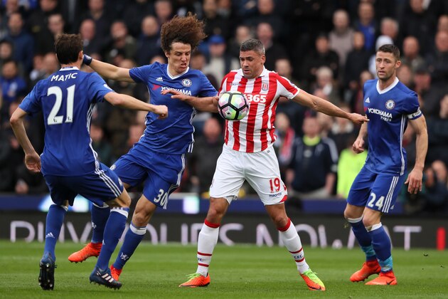 STOKE ON TRENT, ENGLAND - MARCH 18:  Jonathan Walters of Stoke City competes with David Luiz of Chelsea during the Premier League match between Stoke City and Chelsea at Bet365 Stadium on March 18, 2017 in Stoke on Trent, England.  (Photo by Matthew Ashton - AMA/Getty Images)