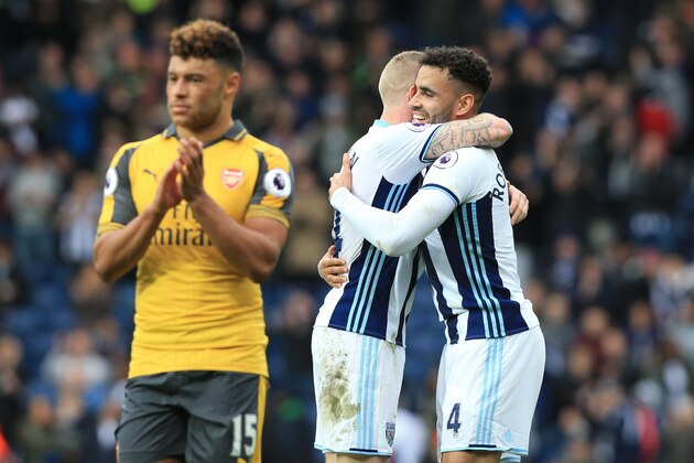 West Bromwich Albion's Irish midfielder James McClean (C) and West Bromwich Albion's English-born Welsh striker Hal Robson-Kanu celebrate after winning the English Premier League football match between West Bromwich Albion and Arsenal at The Hawthorns stadium in West Bromwich, central England, on March 18, 2017.
 / AFP PHOTO / Lindsey PARNABY / RESTRICTED TO EDITORIAL USE. No use with unauthorized audio, video, data, fixture lists, club/league logos or 'live' services. Online in-match use limited to 75 images, no video emulation. No use in betting, games or single club/league/player publications.  /         (Photo credit should read LINDSEY PARNABY/AFP/Getty Images)