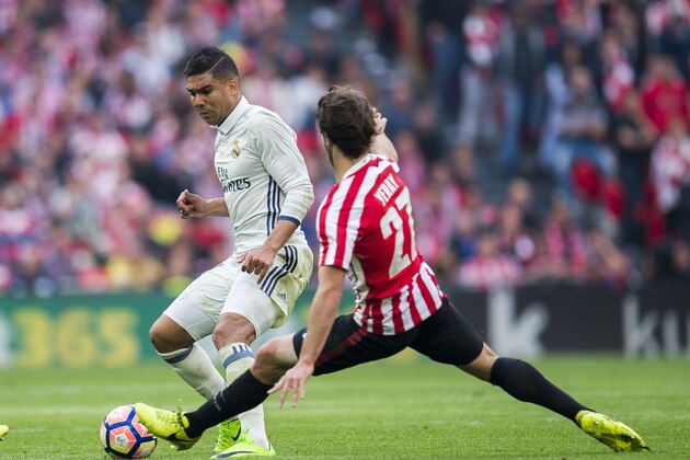 BILBAO, SPAIN - MARCH 18:  Casemiro of Real Madrid competes for the ball with Yerran Alvarez of Athletic Club during the La Liga match between Athletic Club Bilbao and Real Madrid at San Mames Stadium on on March 18, 2017 in Bilbao, Spain.  (Photo by Juan Manuel Serrano Arce/Getty Images)