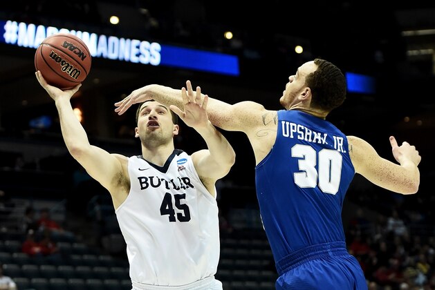 MILWAUKEE, WI - MARCH 18:  Andrew Chrabascz #45 of the Butler Bulldogs attempts a shot while being guarded by Reggie Upshaw #30 of the Middle Tennessee Blue Raiders in the first half during the second round of the 2017 NCAA Tournament at BMO Harris Bradley Center on March 18, 2017 in Milwaukee, Wisconsin. (Photo by Stacy Revere/Getty Images)