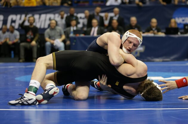 ST. LOUIS, MO - MARCH 17: Bo Nickal of the Penn State Nittany Lions throws Sammy Brooks of the Iowa Hawkeyes to his back and wins their semifinal match by fall during session four of the NCAA Wrestling Championships on March 17, 2017 at the Scottrade Center in St. Louis, Missouri. (Photo by Hunter Martin/Getty Images)