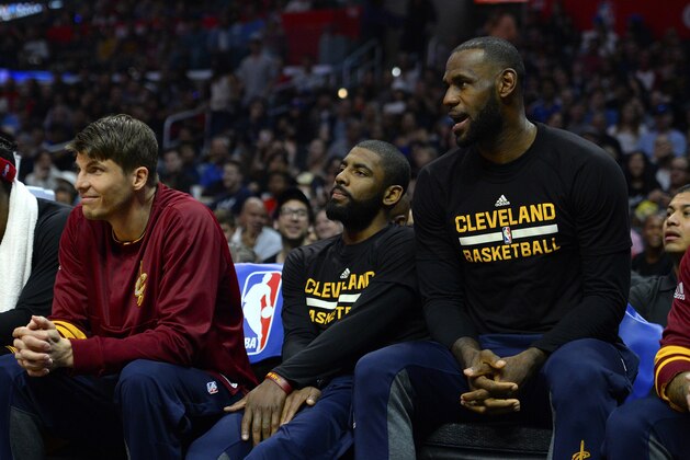 LOS ANGELES, CA - MARCH 18:  (left to right) Kyle Korver #26, Kyrie Irving #2 and Lebron James #23 of the Cleveland Cavaliers sitting out the game against the Los Angeles Clippers on March 18, 2017 at STAPLES Center in Los Angeles, California. NOTE TO USER: User expressly acknowledges and agrees that, by downloading and or using this photograph, User is consenting to the terms and conditions of the Getty Images License Agreement.  (Photo by Robert Laberge/Getty Images)