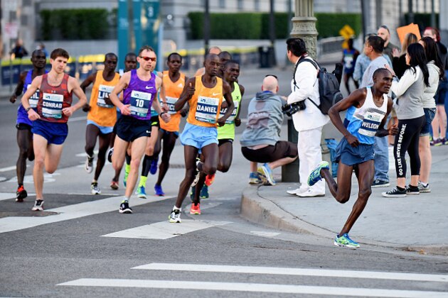 LOS ANGELES, CA - FEBRUARY 14:  Weldon Kirui of Kenya leads a pack of runners during the 2016 Skechers Performance Los Angeles Marathon on February 14, 2016 in Los Angeles, California.  (Photo by Jonathan Moore/Getty Images)